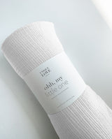 Musselindecke in weiß gerollt mit Banderole: "ohh, my little one"